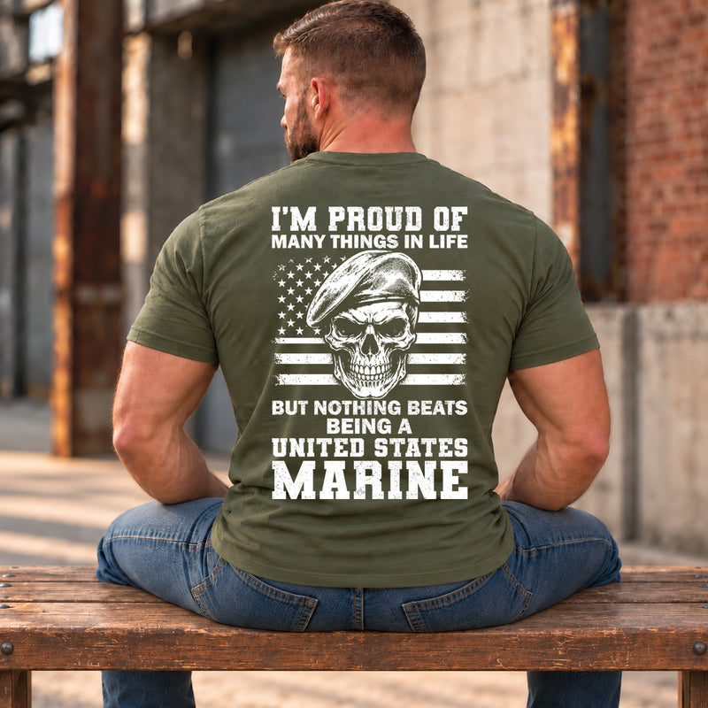 Man wearing a military green Being A Marine custom year veteran T-shirt, back print view