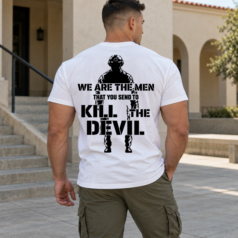 Man wearing a white Kill The Devil custom year veteran T-shirt, back print view, stone building courtyard with stairs