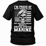 Back view of a black Being A Marine custom year veteran T-shirt with Beret skull on distressed American flag