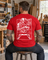 Man wearing a red How to make a marine happy marine veteran T-shirt, back print view, stool in a woodworking shop