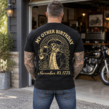 Man wearing a black My Other Birthday custom year veteran T-shirt, back print view, open garage with a motorcycle inside