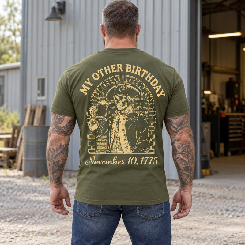 Man wearing a military green My Other Birthday custom year veteran T-shirt, back print view