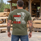 Man wearing a military green We Fight What You Fear custom year veteran T-shirt, back print view