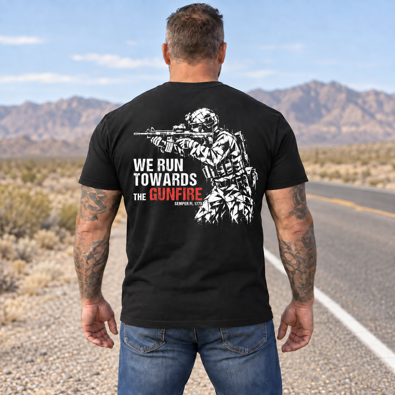 Man wearing a black We Run Towards the Gunfire custom year veteran T-shirt, back print view